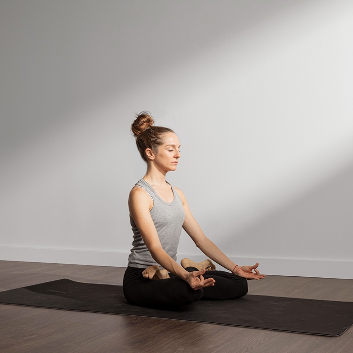 adult-woman-meditating-home