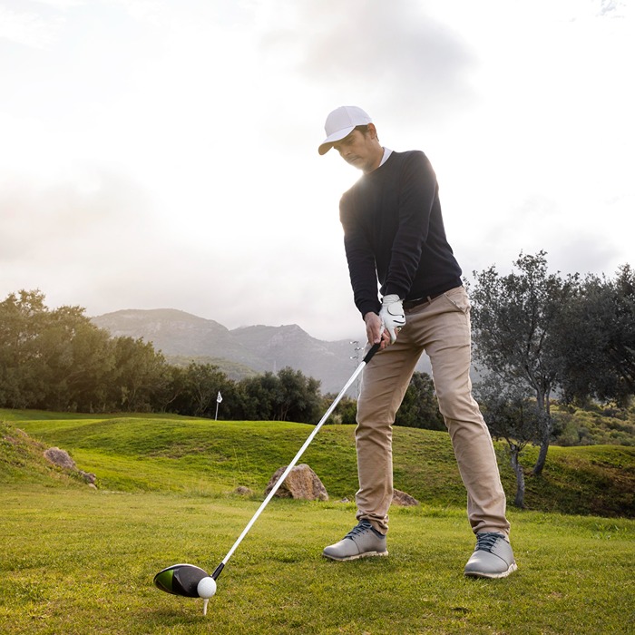 man-playing-golf-field-with-club